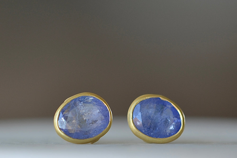 A new and smaller version of Pippa Small Classic Stud studs earrings in Tanzanite and 18k yellow gold.