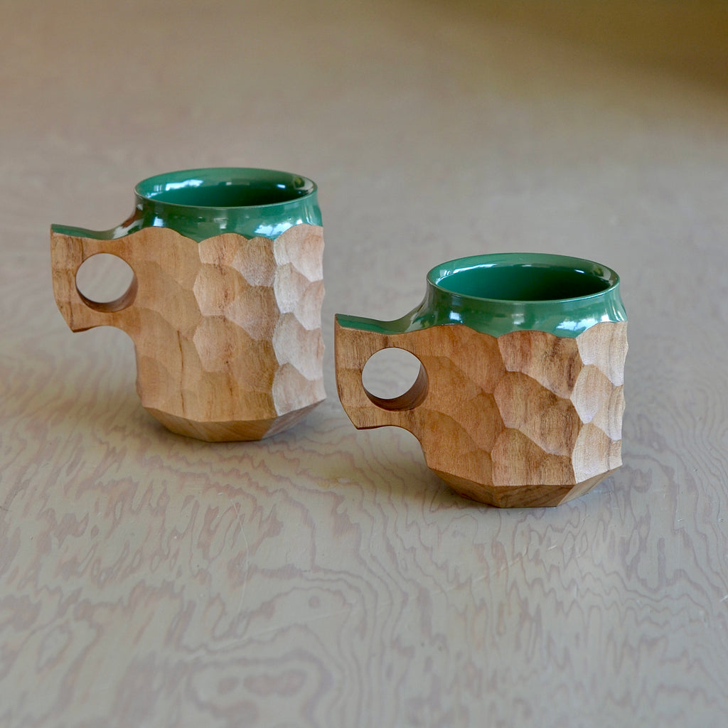 Lifestyle shot of large and medium Urushi green jincups in large and medium.