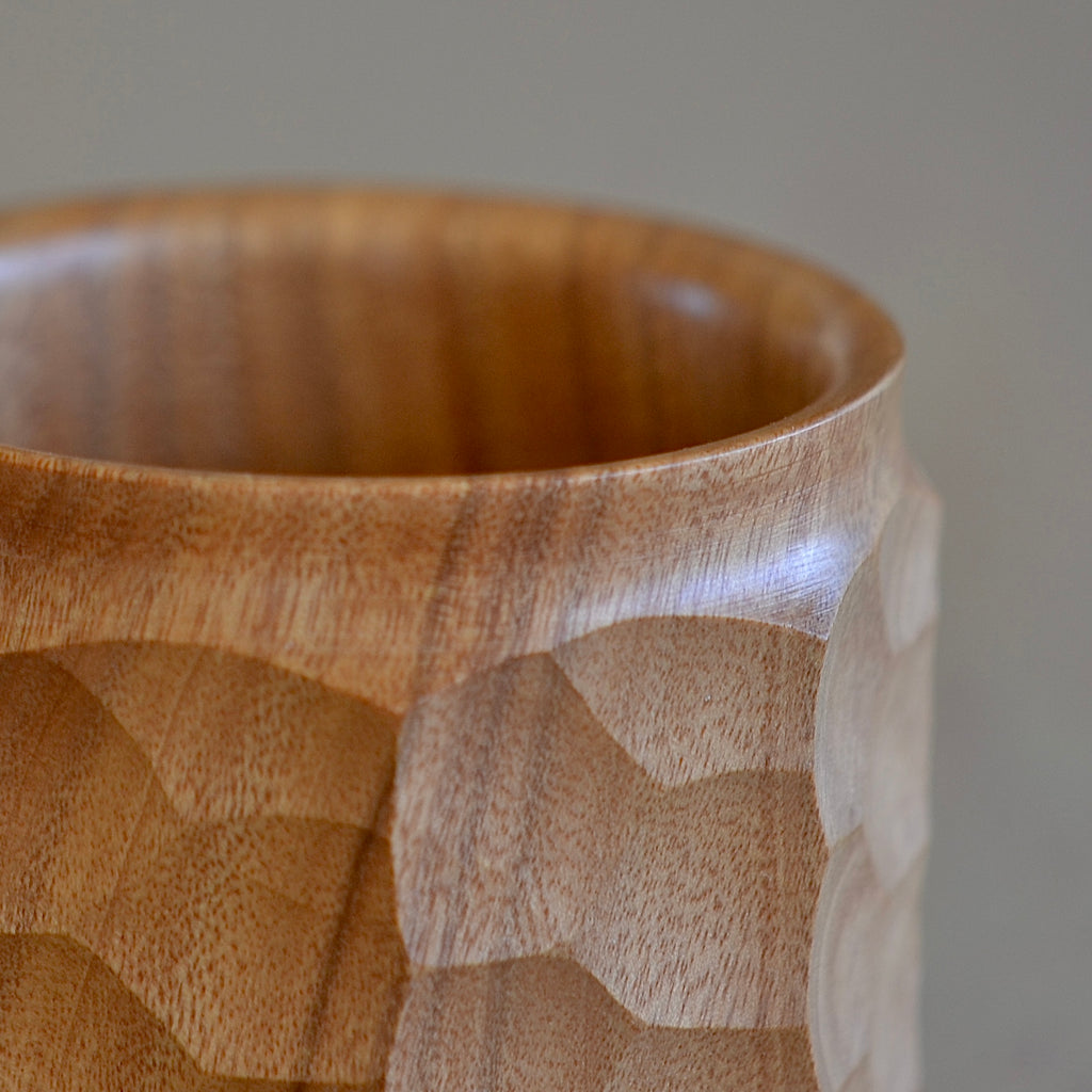 Close up on carving in wood jincup from Akihiro woodworks.