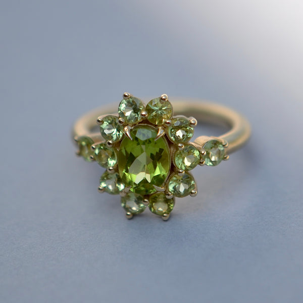 Peridot Chroma Ring by Katie Sanchez Finn of Elizabeth Street Jewelry on gray background.