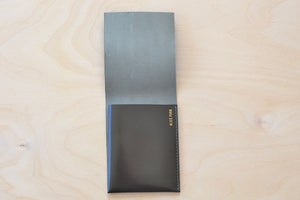 
            
                Load image into Gallery viewer, Inside of Dark Brown Alice Park simple flap wallet with olive stitching.
            
        