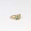 Emerald Trio ring by Elizabeth Street Jewelry comprises of three (3) Columbian emeralds set in 14k yellow gold on a satin brushed round band.