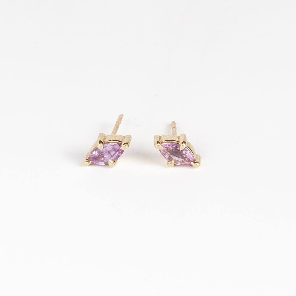 Eagle Claw Stud Earrings in Purple Sapphire by Elizabeth Street Jewelry are Marquise Sapphire Stud Earrings in violet purple to lilac that are bezel set marquise cut sapphires in a four prong eagle claw setting with post closure in 14k satin gold form these elegant everyday studs.