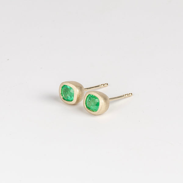 Side view of Bezel set Emerald stud earrings by Elizabeth Street Jewelry.