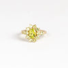 Peridot Chroma Flower ring by Elizabeth Street Jewelry is a one of a kind, bezel set and oval peridot with halo on a narrow band in 14k gold. Handmade in Los Angeles.