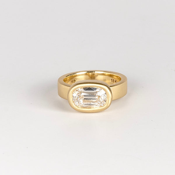 Jumbo Old Mine Solitaire Signet ring by Elizabeth Street is a bezel set cushion cut old mine lab grown white diamond solitaire on a wide and polished 18k gold band sized 6.5.