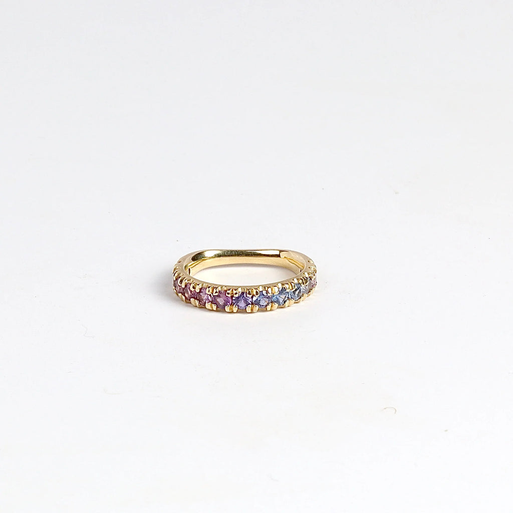 Purple Ombre Sapphire Euro Band by Elizabeth Street Jewelry is a gradient of mid purple to pink rose cut sapphires set into a&nbsp; euro eternity band in 14k gold. This band has a nearly flat back/underside for ultimate comfort and is perfect for stacking. Handmade in Los Angeles.