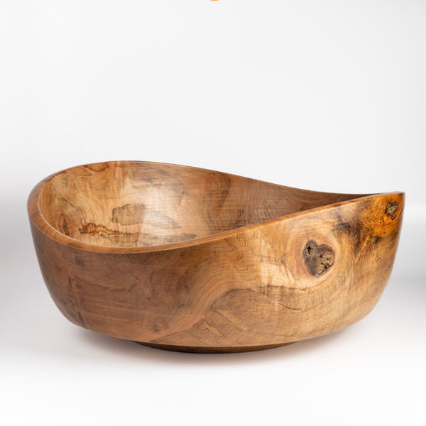 Large Circle Factory Bowl in Maple 18 x 7 is a large turned wood bowl in natural Maple by George Peterson. Made from salvaged wood in North Carolina. Food safe, but finish can be affected if in contact with anything acidic. One of George's bowls is also known as the apple bowl from Obama's White House Oval office. It is called the OK bowl and was a collaboration between George and Larry.