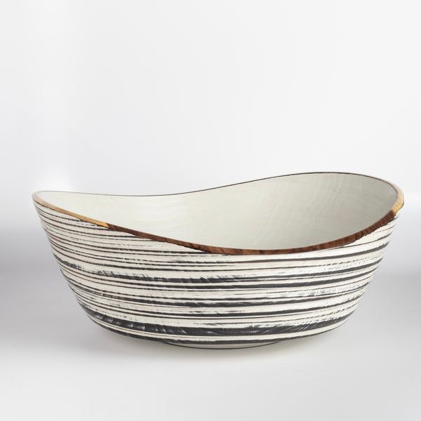 Circle Factory Painted Bowl 16x6 is a  turned wood bowl in Maple, painted black and white, with ridged grooves and stitch detailing by George Peterson. Made from salvaged wood in North Carolina and painted. Food safe, but finish can be affected if in contact with anything acidic.
