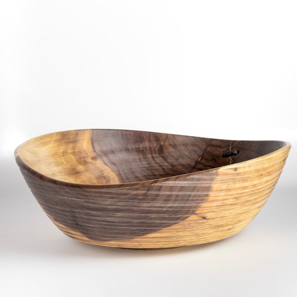 Alternate side of Circle Factory turned wood bowl in walnut with ridged grooves and stitch detailing by George Peterson. Made from salvaged wood in North Carolina and painted. Food safe, but finish can be affected if in contact with anything acidic.