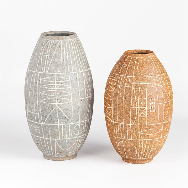 Two hand thrown vases in grey and terracotta.