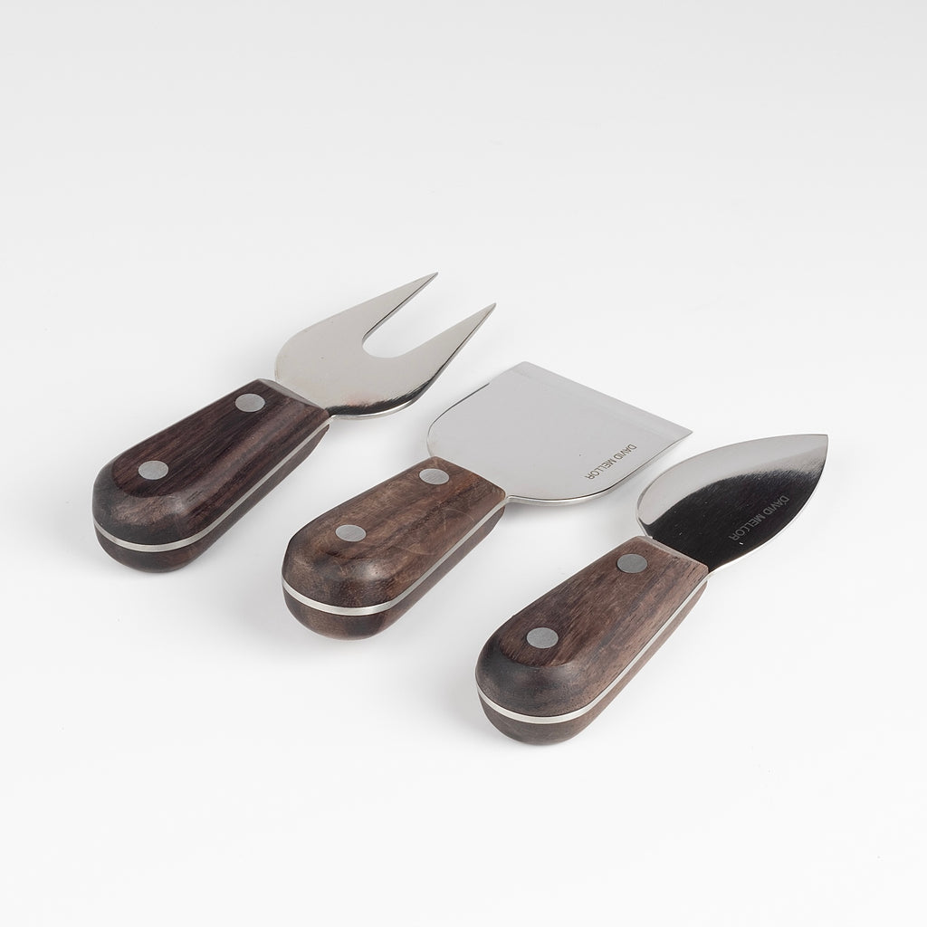 David Mellor Rosewood Cheese Knife Set of 3 is a cheese knife tool set made out of a fork, spade and knife in martensitic steel with mirror polished blades and Indian rosewood handles. Designed by David Mellor and Made in Sheffield, UK.