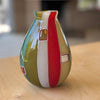 Lifestyle shot of Robin Mix Medium Flat Cane Murrini Vase with Windows 7" is a flat cane vase with Murrini and windows by Robin Mix. 