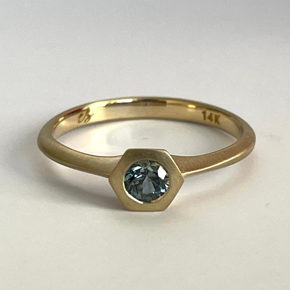 
            
                Load image into Gallery viewer, Petite Hexagon Sapphire Stacking band in teal by Elizabeth Street Jewelry.
            
        