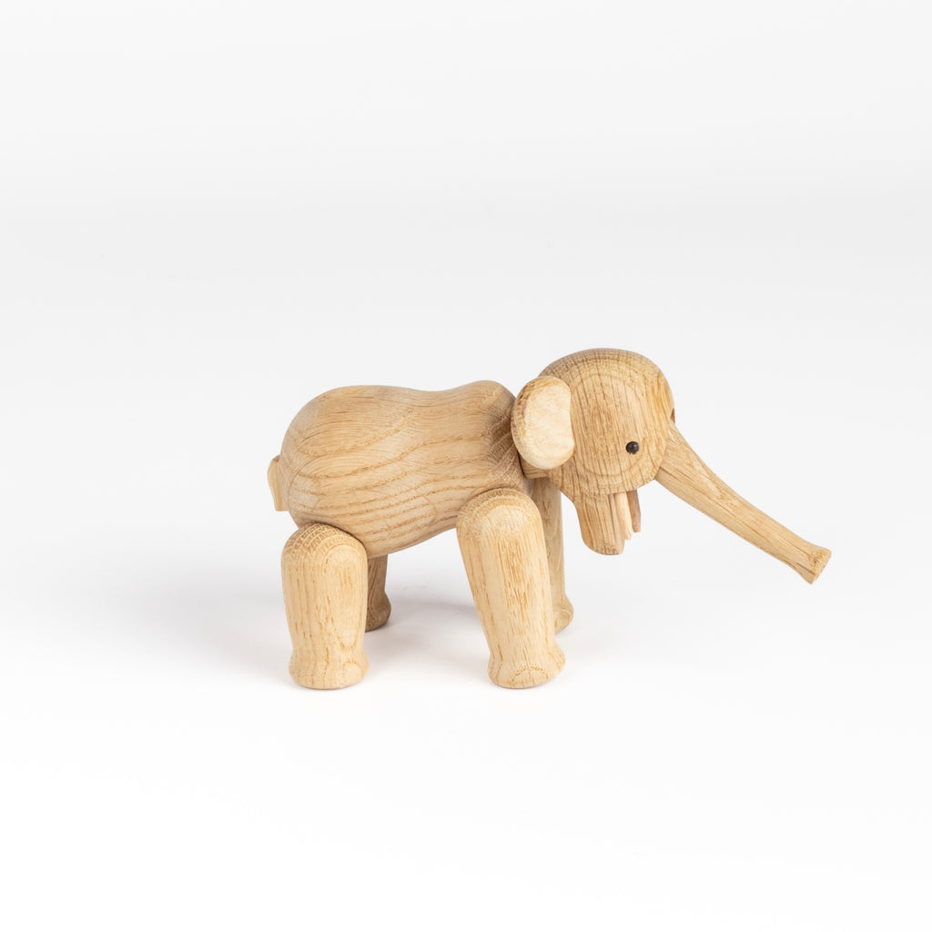 Lilliput wood elephant designed by Kay Bojesen in 1953 is the smallest version of the elephant available in untreated oak.