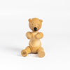 Kay Bojesen Bear in untreated oak on white background.