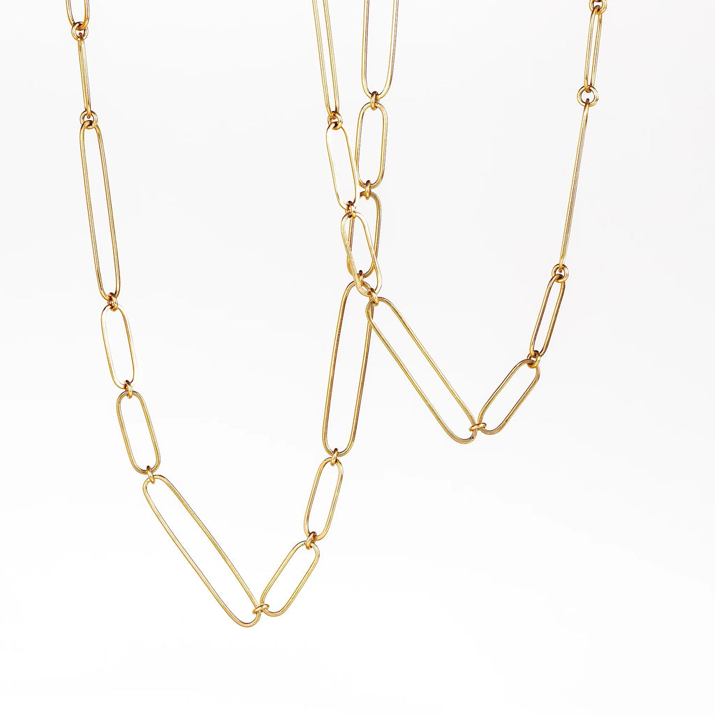 Long and short 14k gold paperclip chains (necklaces) with two short, one long flat clips in 15 or 17 inches by Kaylin Hertel on white background.