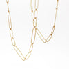 Long and short 14k gold paperclip chains (necklaces) with two short, one long flat clips in 15 or 17 inches by Kaylin Hertel on white background.