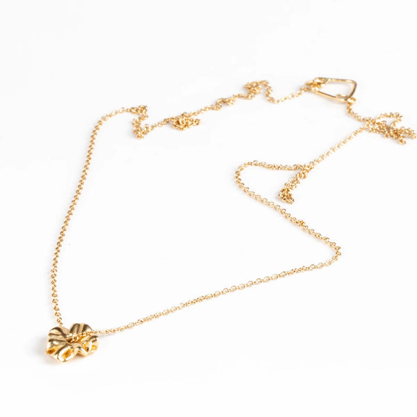 Full view of Ruffle Bead Necklace by Kaylin Hertel on white background. This is a 14k yellow gold bead on an 18" inch chain.