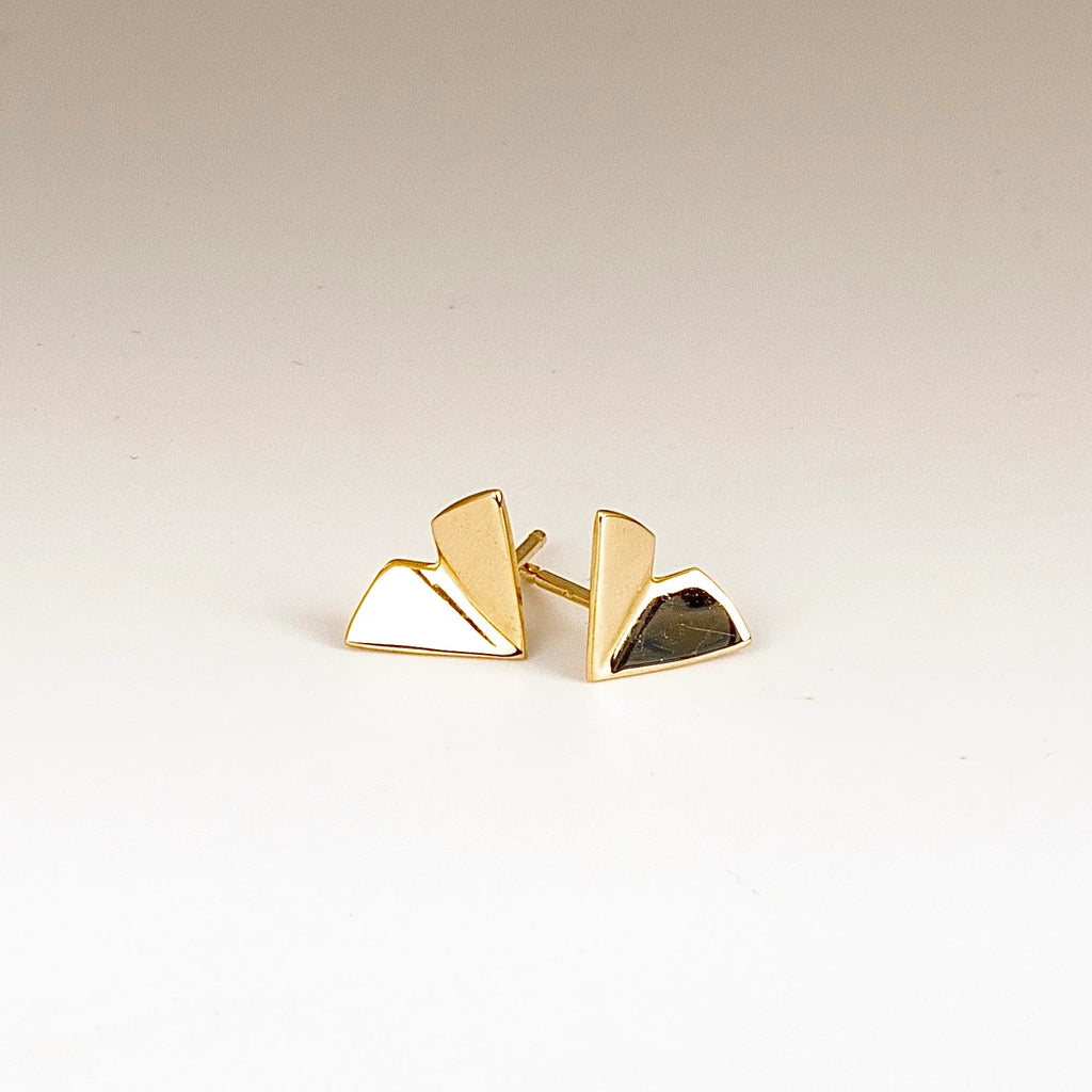 Large Kaylin Hertel Origami stud Studs Earrings in 14k yellow gold on white background.