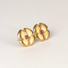 Large flower stud by Kaylin Hertel in magenta pink sapphire on white background.