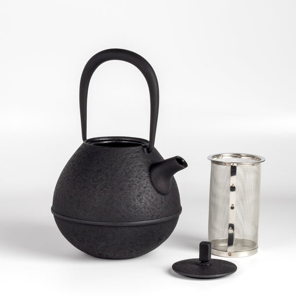 Large Cast Iron Teapot called Egg from Kukan Chuzo in Japan with infuser and lid on white.