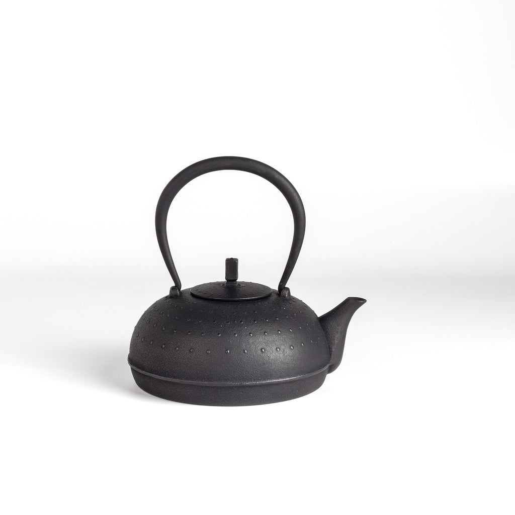 Sayu Cast Iron Kettle Nambu Large by Kukan Chuzo is made in traditional Nambu Tetsubin style. It is meant for stovetop use. It is not coated with enamel therefore naturally softens the water by enriching it with iron. The more use it gets the better the water. Make sure to pour out every drop of water after use, remove the lid and let the kettle dry so it doesn't rust. Made and designed by Hisao Iwashimizu in Iwate, Japan.