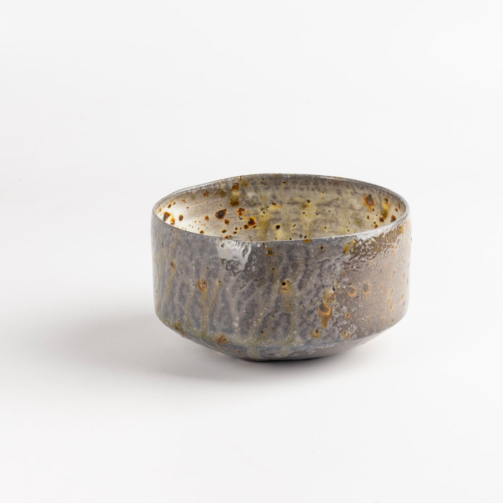 Wood Fired Tea Bowl With Spots on White by Lilith Rockett is a one of a kind wood fired and reduction cooled tea bowl in bluish grays, browns and white with dark spots. Hand thrown porcelain by Lilith Rockett, who works out of Portland, Oregon.