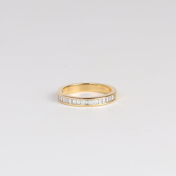 Vertical Petite Baguette Diamond Half Eternity Band by Lizzie Mandler is a half eternity band of vertical baguette diamonds in a channel setting and 18k gold.  .32tcw G/H VS1 Size 6.5 in stock. Handmade in Los Angeles.