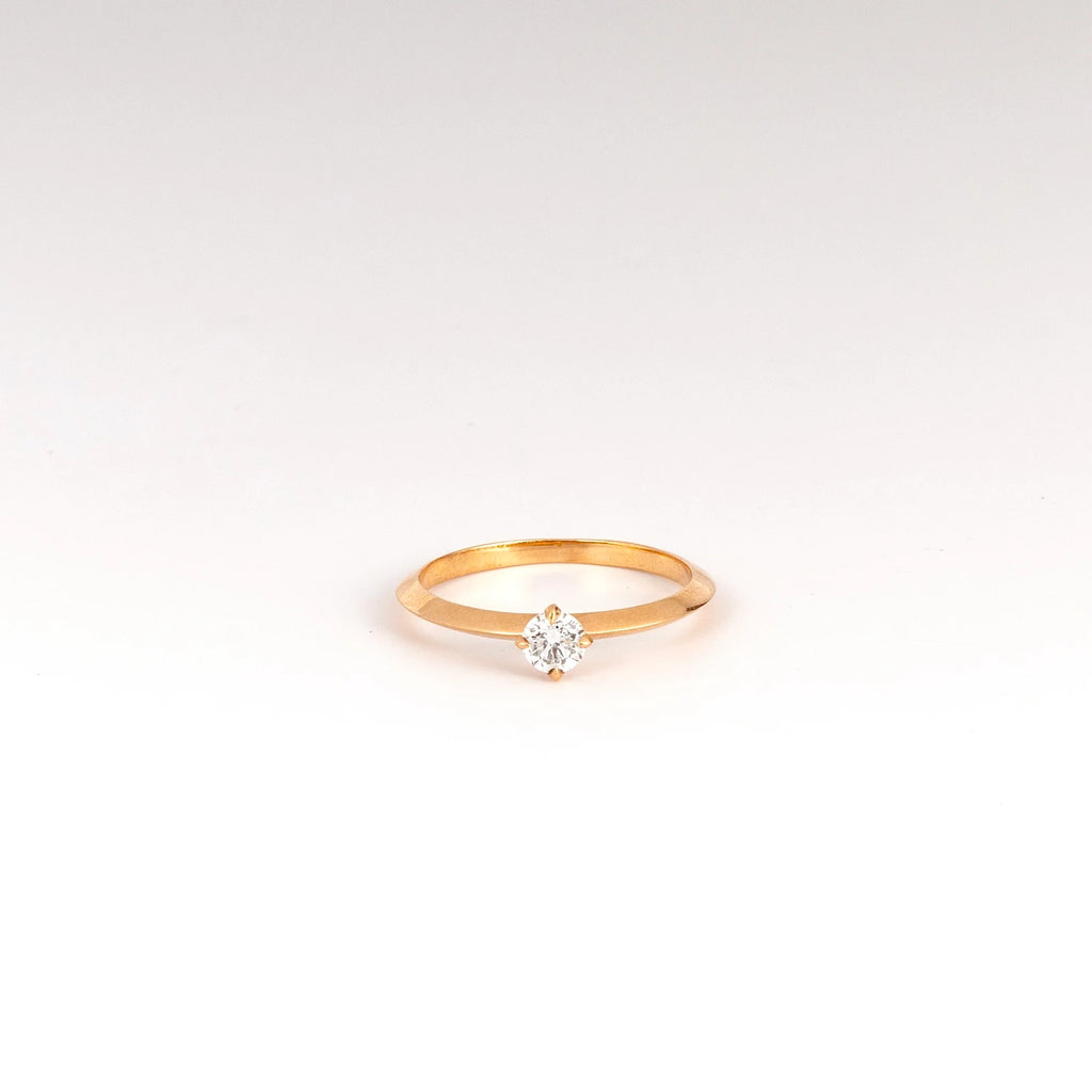 Lizzie Mandler Petite Knife Edge Solitaire ring diamond brilliant cut prong setting 18k rose gold on white background.
