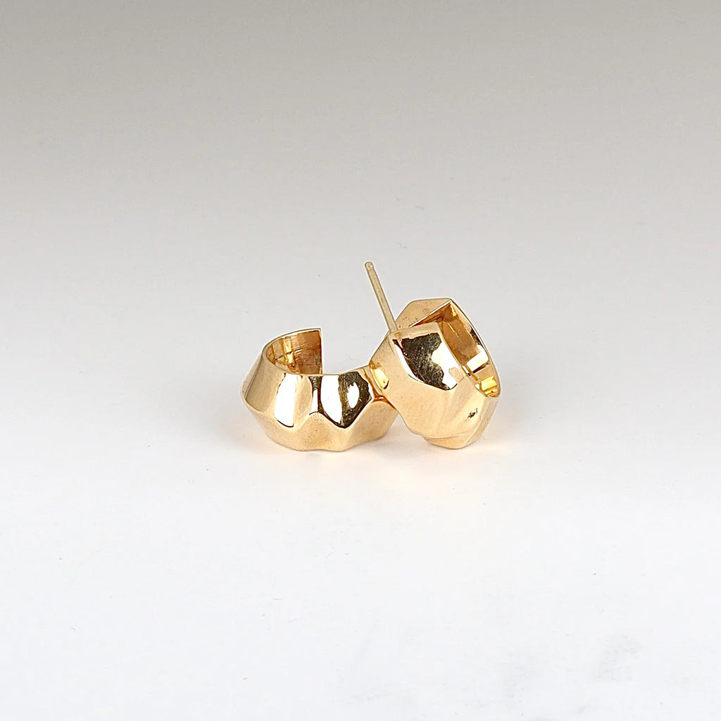 Liquid Gold Huggies by Lizzie Mandler on white background.