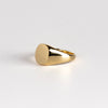 Side view of large oval reflection signet ring in 18k yellow gold by Makiko Wakita Wakitala. This ring is unisex.