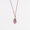 Super 7 Pendant Necklace designed by Margaret Solow is a An Individual faceted, translucent and purple Super 7 crystal slice with natural inclusions set in 14k gold with with a gold bead on the string makes this one of a kind organic pendant necklace.