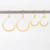 Marian Maurer medium and small Dakri Hoop Earrings with ear wire in 18k recycled yellow gold with satin finish.