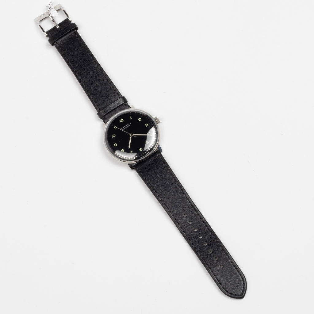 Full image of Max Bill 38mm Automatic Watch in Black Dial with Numbers but no date and black leather band, a modernist classic designed wrist watch by designer Max Bill for Junghans.