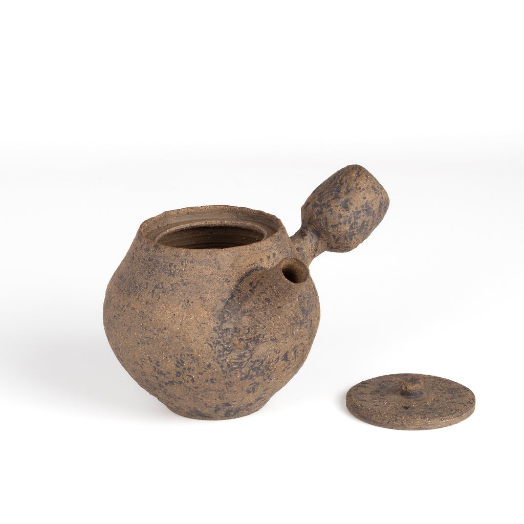 Kyusu Ceramic teapot in brown from Muzuri Ware with lid on the side.