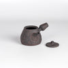 Dark brown Kyusu teapot D by Muzuri ware with lid on the side.