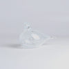 OIva Toikka Mediator Dove in clear glass with white pattern design from Iittala on white background.