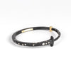 Nail Bracelet 1/3 ct Top Sprinkle by Pat Flynn is a forged iron bangle or cuff-like bracelet in the shape of a nail with a scattering of white diamonds and 18k gold  hinge. 