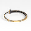 Back of Nine Stone Dust 9 Nail Bracelet by Pat Flynn.