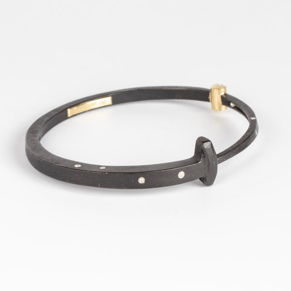 Nine Stone 9 Bracelet Large is a forged nail bracelet with nine scattered accent diamonds and completed with an 18k gold hinge and ball catch closure sized for men.  Handcrafted in New York.