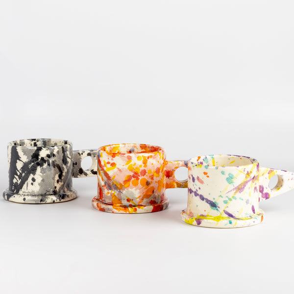 A selection of EXP standard splatter mugs by Peter Shire and Echo Park Pottery.