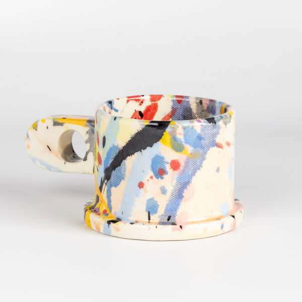 Alternate side of EXP Standard Splatter Mug in Yellow, Peach, Pink, Blue and Black