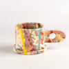 EXP Standard Splatter Mug in Pink with Yellow and Turquoise Stripes is a glazed ceramic mug with a rounded handle, made by utilizing slab construction that is hand rolled. Inspired by the techniques of Adrian Saxe and the paintings of Sam Francis, the mug was designed by LA artist, Peter Shire for Echo Park Pottery. Peter is one of the original members of the Memphis Group, founded by Ettore Sottsas in Italy. Handbuilt in Echo Park, Los Angeles.