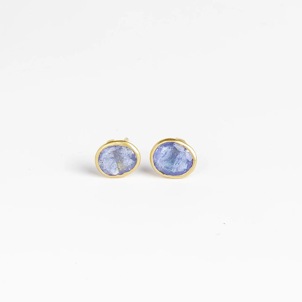 A new and smaller version of Pippa Small Classic Stud studs earrings in Tanzanite and 18k yellow gold.
