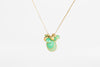Colette Chrysoprase Cluster Necklace in Flourishing Greens is a necklace by Pippa Small Jewelry in the Flourishing Greens color way is a cluster of bezel set Chrysoprase stones in various sizes with two hammered 18k gold seed beads and one mini croissant bead on a 22" golden waxed cotton cord.