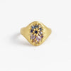 Encrusted Lotus signet by Polly Wales in purple and blue sapphires.
