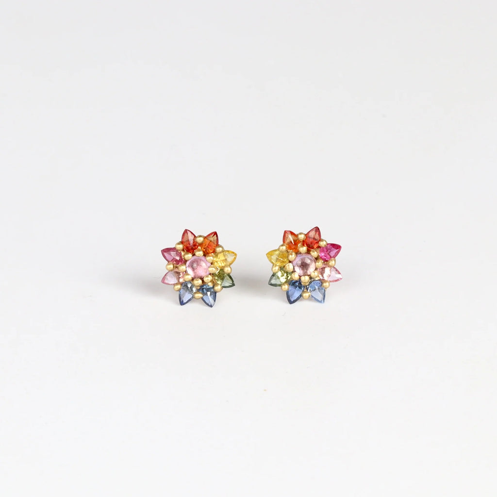 Rainbow Daisy studs (pair) by Polly Wales on white background.