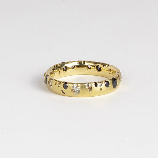 Other side of Polly Wales Confetti Band ring in black and white sapphires.