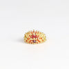 Neli Half Shield ring by Polly Wales is a Mixed cut orange to red sapphires (1.97tcw) in an OK exclusive one of a kind color way called "Carly-fornia Sunset" layered on 18k recycled yellow gold band. Cast not set. 